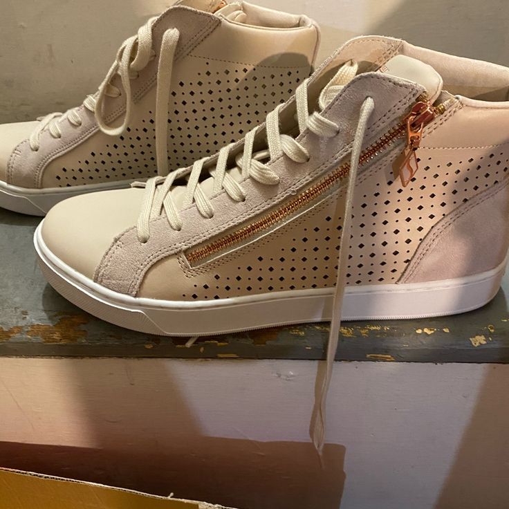 Cream Casual Sneaker With Gold Embellishments Spring High-top Sneakers With Perforated Toe Box, Trendy Beige Sneakers With Perforated Toe Box, Trendy High-top Sneakers With Perforated Toe Box For Spring, Spring Casual High-top Sneakers With Perforations, Casual High-top Sneakers With Perforations For Spring, Chic Sneakers With Perforated Toe Box, Chic Lace-up Sneakers With Cushioned Footbed, Chic Lace-up Synthetic Sneakers, Shoes Cream