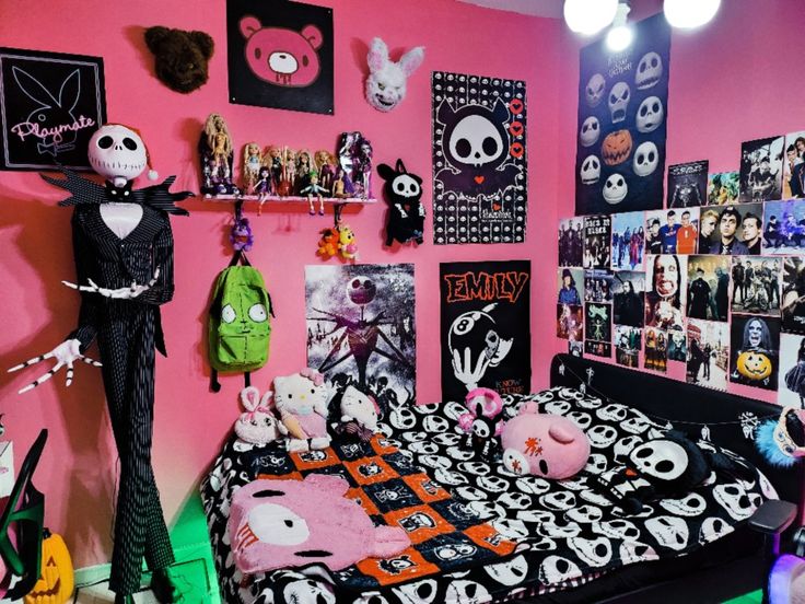 a bedroom decorated in pink, black and white with lots of halloween decorations on the walls