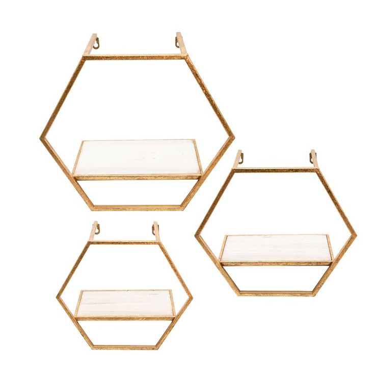 three gold hexagonal shelves with glass shelves