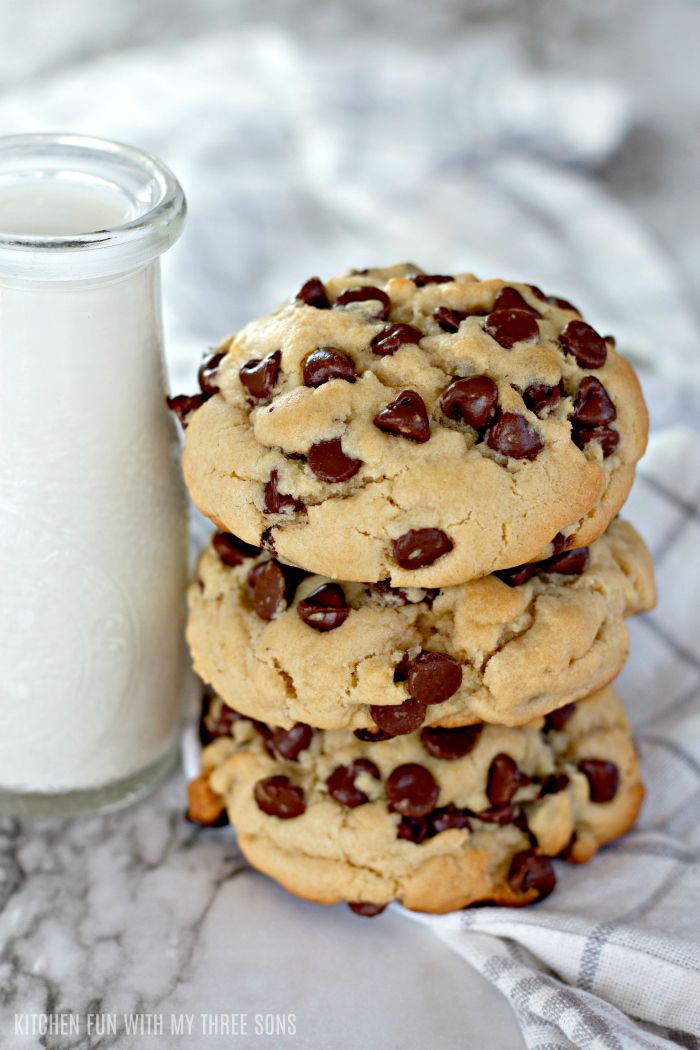 chocolate chip cookies next to a glass of milk