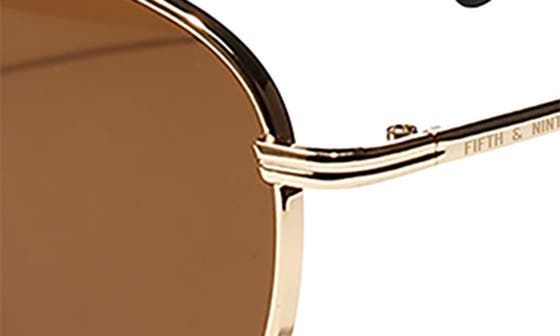 The fusion of classic style and modern polycarbonate lenses elevate eye-catching sunglasses. 50mm lens width; 20mm bridge width; 140mm temple length 100% UV protection Polycarbonate lenses Polycarbonate/metal Imported | Fifth & Ninth Jackson 50mm Round Sunglasses Classic Gold Shield Sunglasses With Uva Protection, Classic Brown Shield Sunglasses With Uv Protection, Classic Gold Polarized Aviator Sunglasses, Classic Gold Aviator Sunglasses With Polarized Lenses, Modern Brown Aviator Sunglasses With Uva Protection, Classic Rimless Aviator Sunglasses For Summer, Classic Brown Shield Sunglasses With Mirrored Lenses, Classic Rimless Aviator Sunglasses With Uv Protection, Gold Rimless Shield Sunglasses With Polarized Lenses