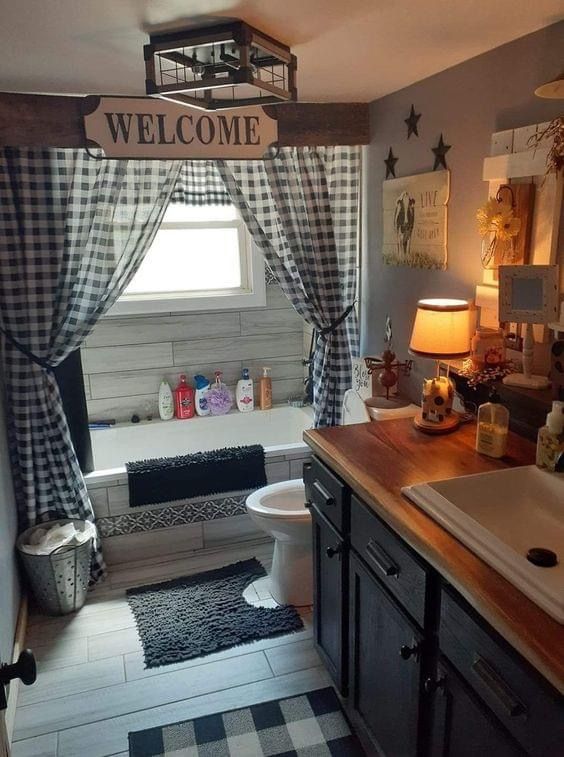 a bathroom with black and white checkered rugs