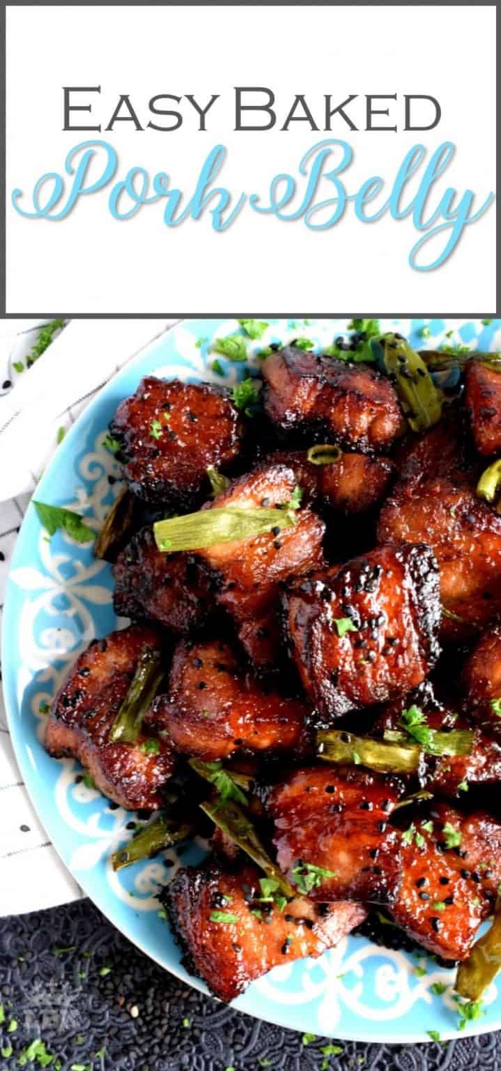 an easy baked pork belly recipe on a blue and white plate with text overlay