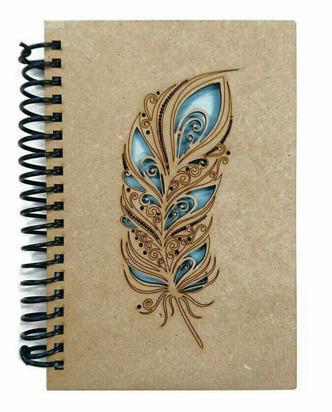 a spiral notebook with a drawing of a blue feather on the front and back cover