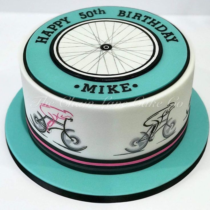 a birthday cake that has a bicycle on it and the words happy 50th, mike