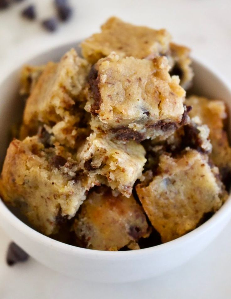 a white bowl filled with chocolate chip cookie bars