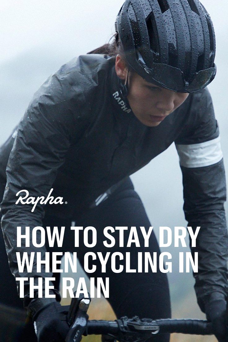 a woman riding a bike with the words how to stay dry when cycling in the rain