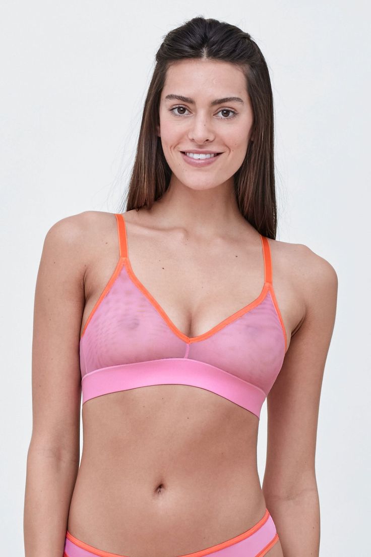 The tringle cups create a natural shape and plunge neckline that will disappear under clothes. The wide bottom band and stretch mesh backs allow for added support and comfort. Complete the look with matching Spellbound pants. Average Coverage Breathable mesh for barely-there feel and natural shape Stretch mesh molded cup Extended triangle cups to enhance flattering plunge neckline Sheer mesh back that is sexy yet comfortable Fully adjustable stretch matte straps and hook and eye for custom fit F Summer Nylon Sports Bra With Mesh Back, Stretch Mesh Bra With Mesh Back, Summer Triangle Top Bra With Light Support, Sheer Pink Bra For Summer, Summer Mesh Sports Bra With Mesh Back, Summer Mesh Stretch Bra, Summer Stretch Mesh Bra, Stretch V-neck Bra For Yoga, Mesh Sports Bra With Built-in Bra For Summer