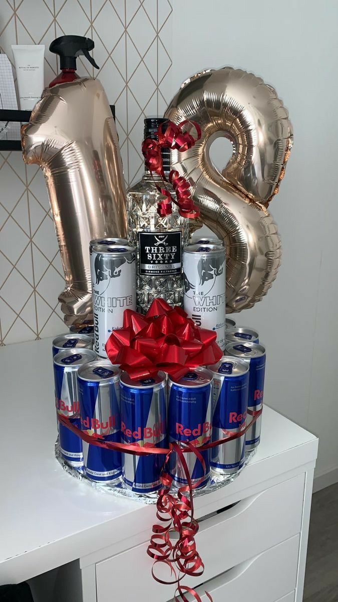 an arrangement of cans and balloons on a table