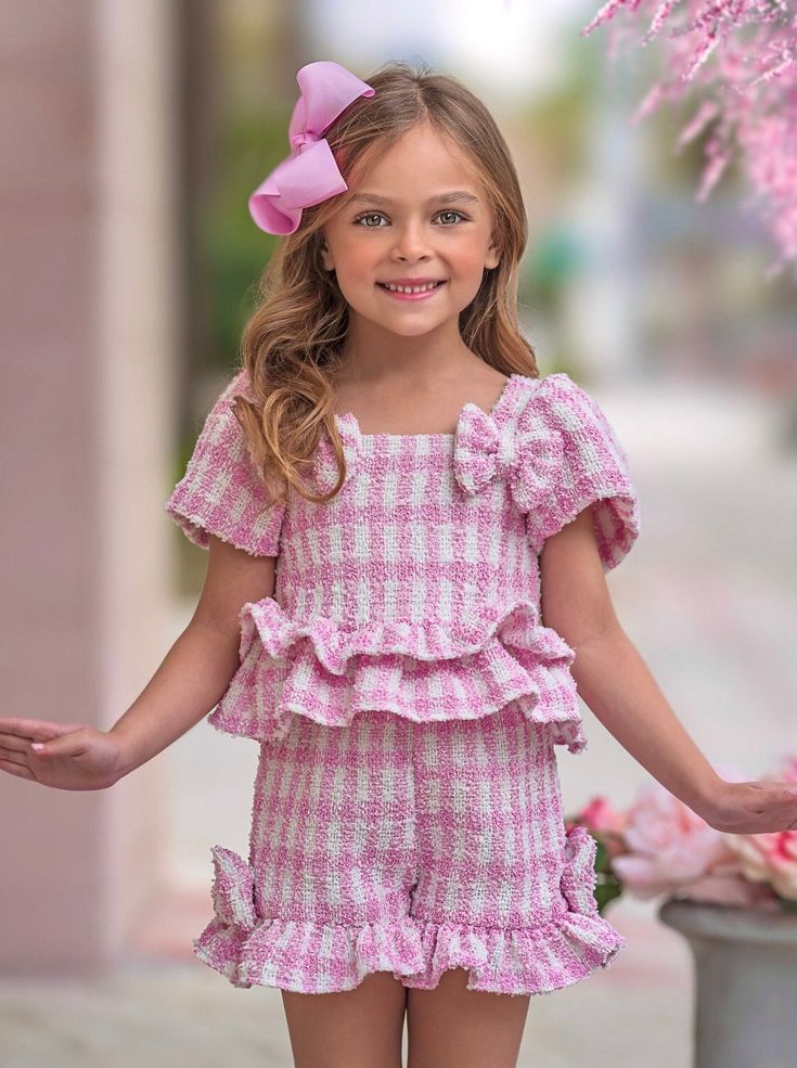 Make picnics and playdates extra fashionable with our pink gingham top and shorts set. This photo-ready pairing makes your little diva stand out in your next family pics. Get ready for the compliments because everyone will be impressed! Shorts design offers maximum coverage to give her the confidence to move and play. Pink Ruffled Sets For Spring, Spring Pink Ruffled Set, Playful Gingham Sets For Spring, Summer Plaid Sets With Short Sleeves, Summer Plaid Short Sleeve Sets, Cute Plaid Sets For Spring, Cute Plaid Spring Sets, Summer Gingham Short Sleeve Sets, Summer Gingham Sets With Short Sleeves