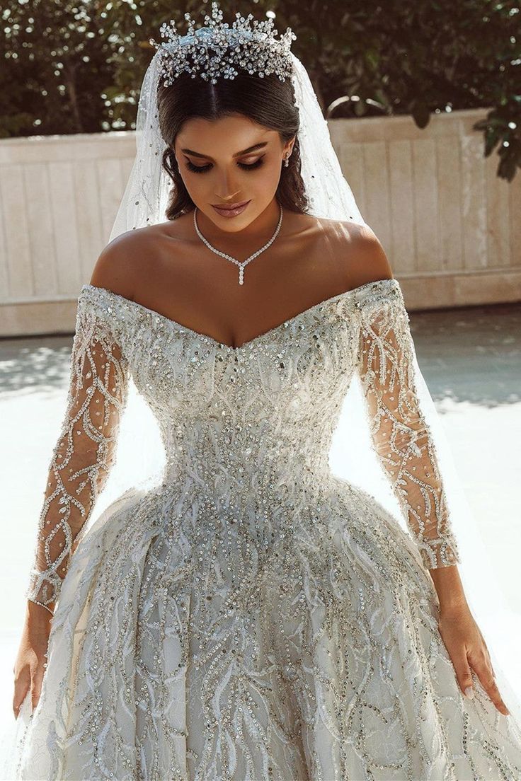 a woman in a wedding dress with a tiara