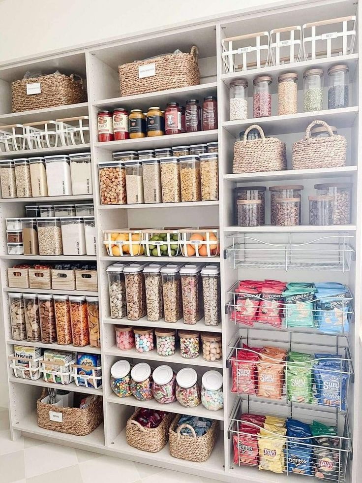 an organized pantry with baskets and food items