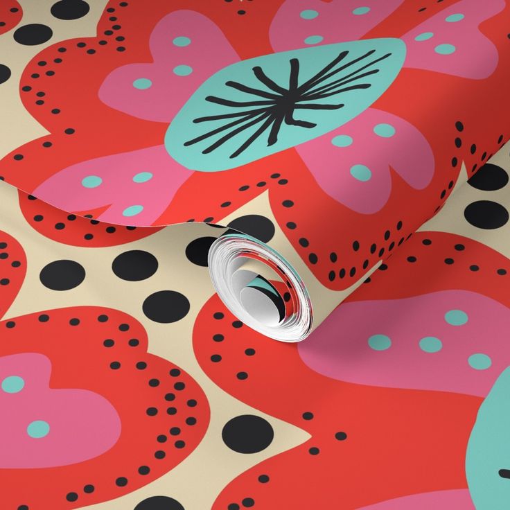 a red and black floral wallpaper with polka dots on the bottom half of it