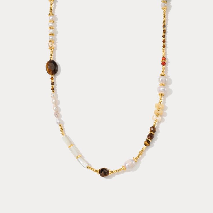 DETAILS Plating: 18K Gold Materials: 18K Gold on Brass, Freshwater Pearl, Natural Stone, Crystal Measurements: Length: 14.57"(37cm) + Extender: 2.17"(5.5cm) Weight: 9.8 g Gold Necklace With Beaded Chain For Vacation, Bohemian Gold Pearl Necklace With Colorful Beads, Gold Natural Stones Jewelry For Vacation, Gold Jewelry With Natural Stones For Vacation, Bohemian Pearl Beaded Necklaces With Gold Beads, Bohemian Pearl Necklace With Gold Beads, Gold Necklaces With Natural Stones For Beach, Gold Necklaces With Round Beads For Vacation, Elegant Beaded Necklaces For Vacation