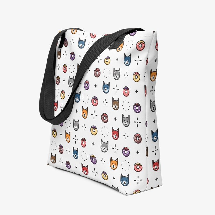 "Cats and donuts on an all over bag? You need one! ⚠️ 𝗣𝗹𝗲𝗮𝘀𝗲 𝗰𝗵𝗲𝗰𝗸 𝘀𝗶𝘇𝗲/𝗰𝗼𝗹𝗼𝗿 𝗰𝗵𝗮𝗿𝘁 𝗶𝗻 𝘁𝗵𝗲 𝗴𝗮𝗹𝗹𝗲𝗿𝘆 𝗳𝗼𝗿 𝗺𝗲𝗮𝘀𝘂𝗿𝗲𝗺𝗲𝗻𝘁𝘀 𝗮𝗻𝗱 𝗮𝘃𝗮𝗶𝗹𝗮𝗯𝗶𝗹𝗶𝘁𝘆! All products ship worldwide. Fulfillment location is set based on shipping destination, routing preferences and stock availability. Fulfillment locations / sizes available: 🔴 US: one size 🔵 EU: one size A spacious and trendy tote bag to help you carry around everything that matters. * 100% spun polyester fabric * Bag 15\" x 15\" (38.1cm x 38.1cm) * Capacity - 2.6 US gal (10l) * Maximum weight limit - 44lbs (20kg) * Dual handles 100% natural cotton bull denim * Handle length 11.8\" (30 cm), width 1\" (2.5cm) * The handles can slightly differ depending on the fulfillment location * Printed on White Reversible Shoulder Bag For Travel, Reversible White Shoulder Bag For Travel, Reversible White Bag For Everyday, White Reversible Bag For Everyday Use, Rectangular Reversible School Bag, Reversible White Canvas Bag For Daily Use, Reversible Rectangular School Bag, Trendy Cat Print Bag For Everyday Use, Casual Rectangular Bags With Cat Design