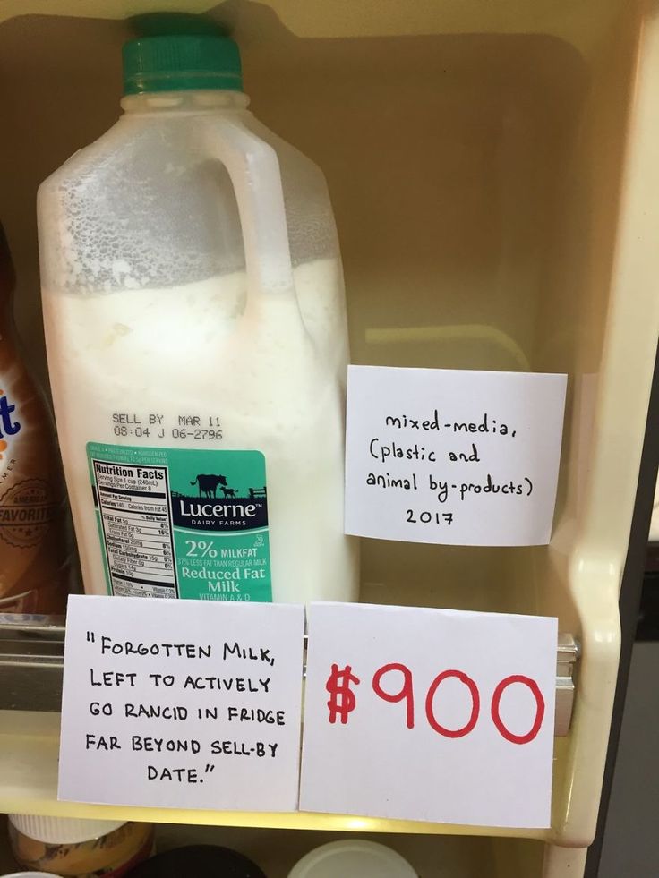 a refrigerator filled with lots of different types of milk and other things to put on it