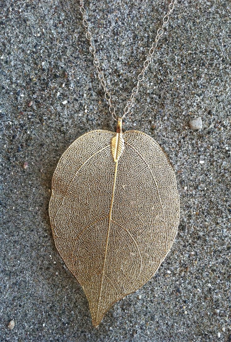 "The perfect BOHO Chic! This natural leaf pendant has been dipped in gold and hangs beautifully from a 30\" long 14K gold fill chain with gold fill spring clasp. The pendant measures 50x75mm and is a perfect long layering piece. Please let me know if you prefer a shorter length and I can make it to your specifications, free of charge. Also available in Silver, please see last photo for example of silver leaf. Each pendant is a one of a kind and shows the distinct lines and markings of each uniqu Nature-inspired Nickel Free Gold Necklace, Nature-inspired Gold Pendant Necklace, Gold Nature-inspired Pendant Necklace, Gold Nature-inspired Necklace With Large Pendant, Nature-inspired Necklace With Large Oval Pendant, Gold Leaf Nature-inspired Jewelry, Nature-inspired Gold Leaf-shaped Jewelry, Gold Leaf Shaped Brass Jewelry, Nature-inspired Gold Leaf Necklace