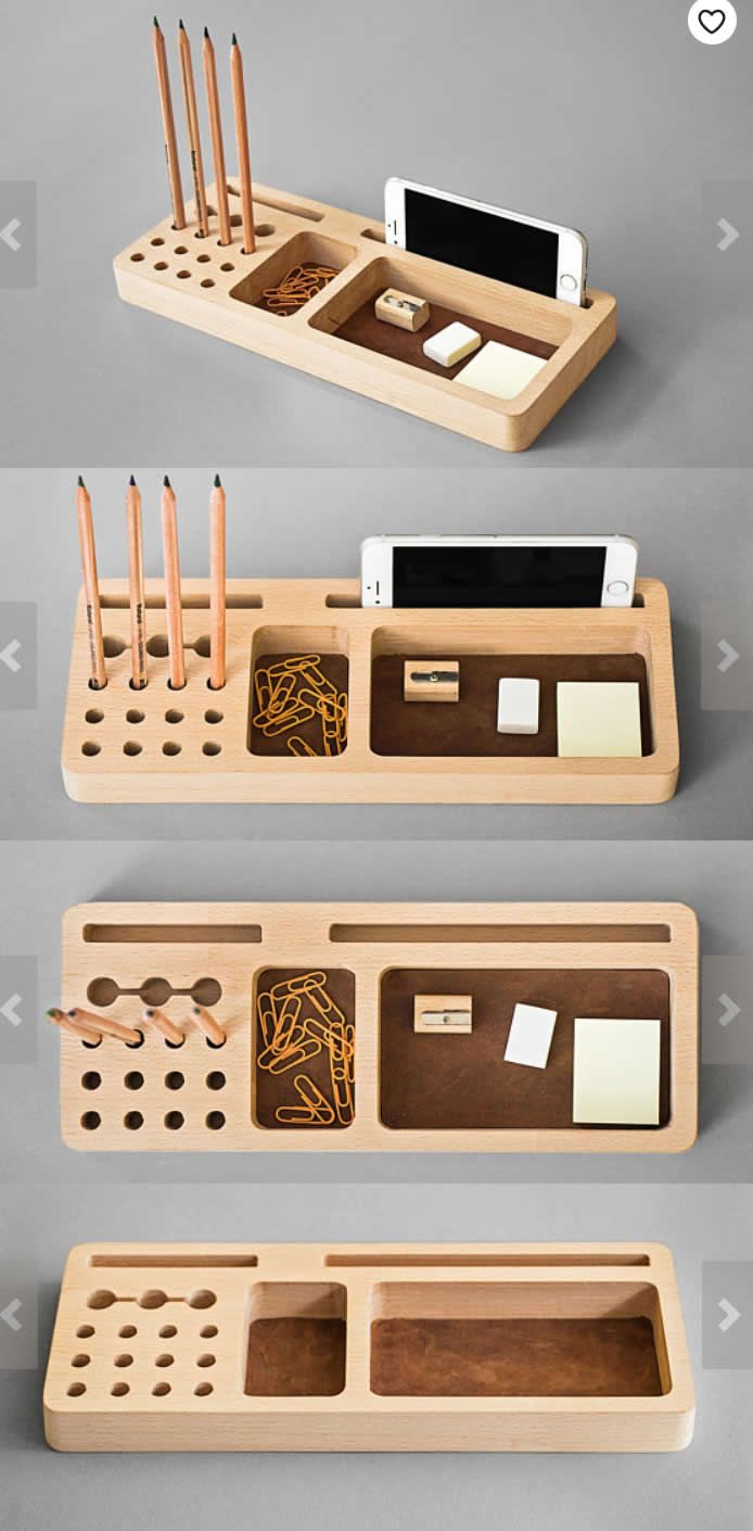 three wooden trays with various items in them and one is holding pens, pencils, and an electronic device