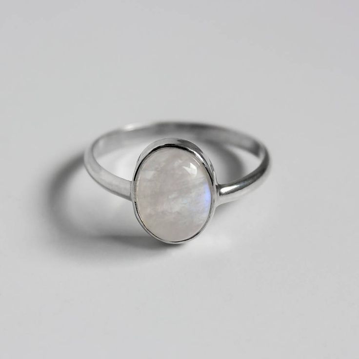 Metal .925 Sterling silver Gemstone(s) 9x7mm Rainbow moonstone Cut Oval cabochon Carat ~2.27 Setting Open bezel Ring Band 2 mm / 12 GA half round Grade AA Sustainable Supply Chain, Bezel Ring, Made Jewelry, Ring Band, Oval Cabochon, Rainbow Moonstone, Sterling Silver Ring, Ring Shopping, Moonstone