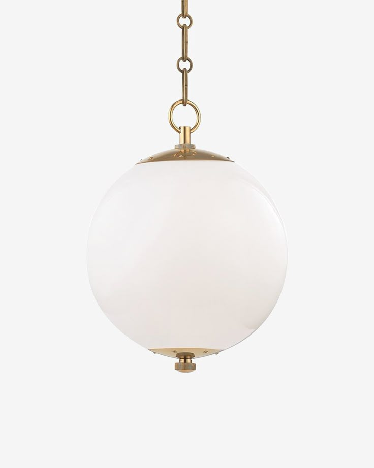 a white glass ball hanging from a brass plated chandelier on a chain