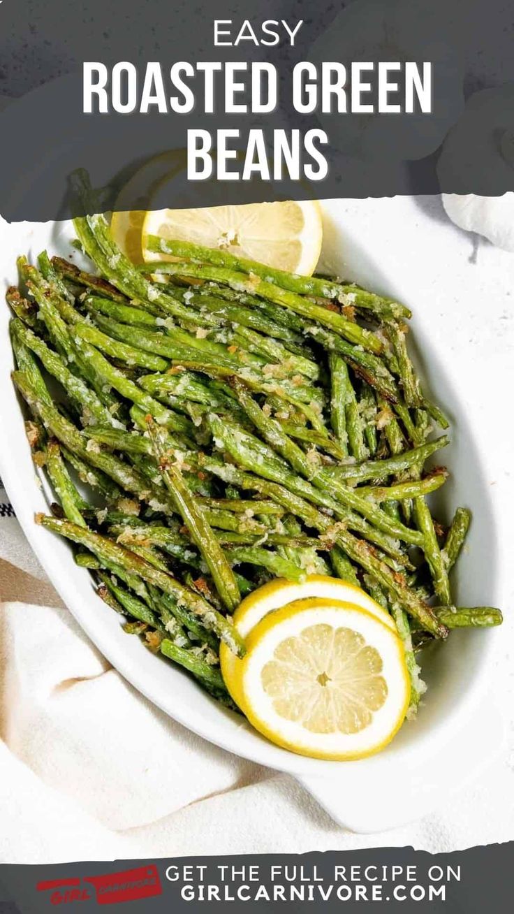 roasted green beans in a white bowl with lemon wedges on the side and text overlay