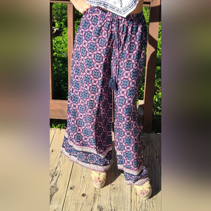 Elastic Waistband. Lightweight. Boho Print With Contrast Border. Soft And Cozy! Boho Mod Paisley Print Style. Casual Pink Bottoms For Festival, Casual Pink Pants For Festival, Casual Purple Bottoms For Festival, Casual Purple Pants For Festival, Cozy Boho, Avenue Design, Floral Print Jumpsuit, Blue Jumpsuits, Wide Leg Cropped Pants