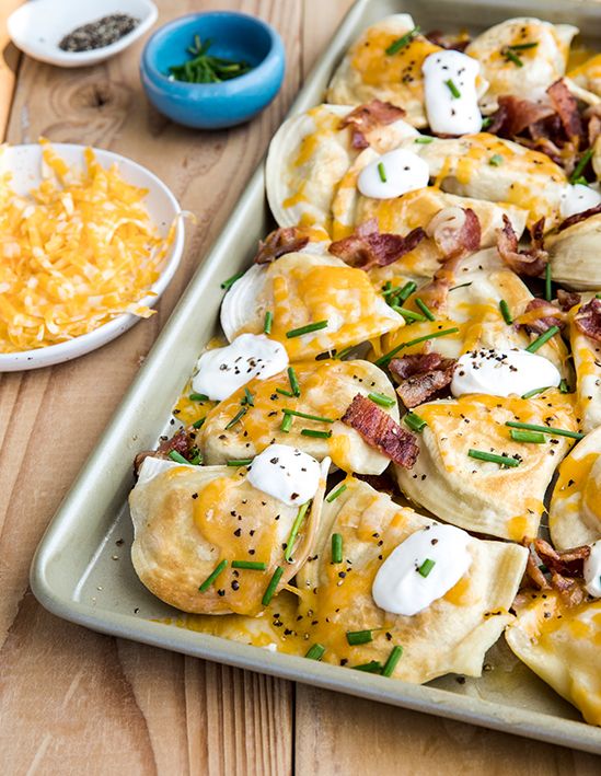 a pan filled with food on top of a wooden table