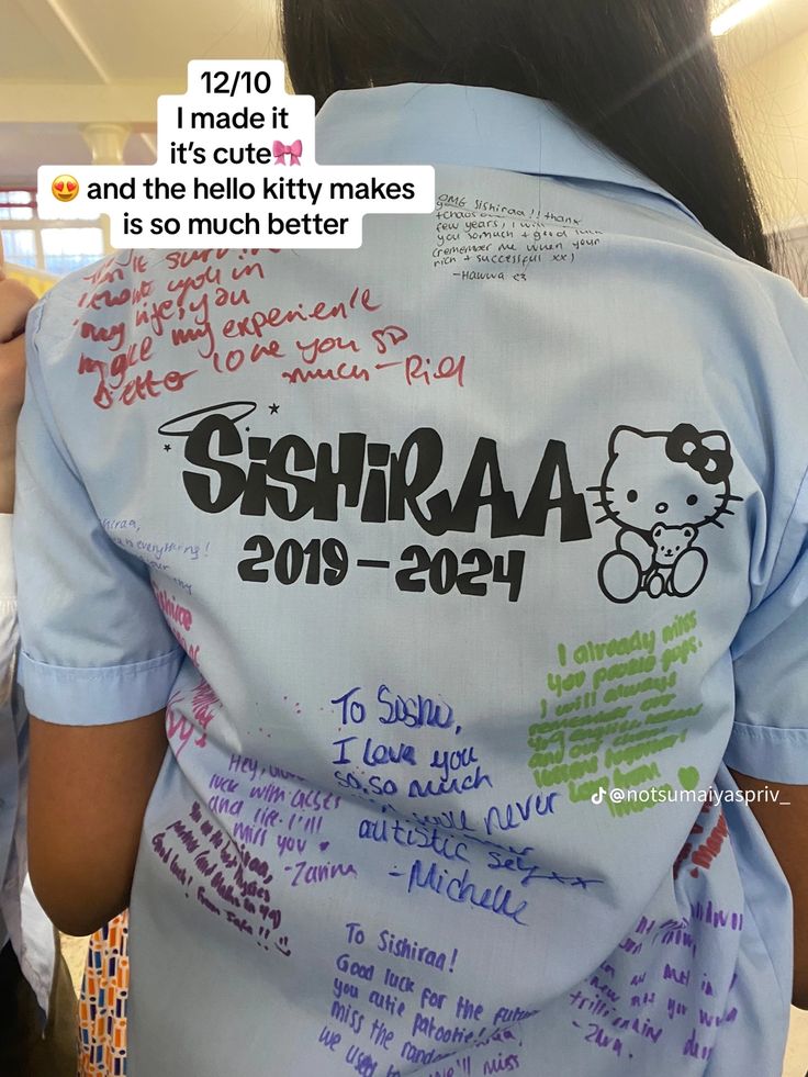 the back of a woman's shirt that has been decorated with writing on it