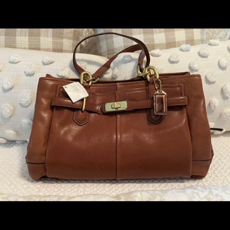 Brand New Never Used Coach Leather Purse Office Tote Satchel With Branded Hardware, Elegant Satchel With Branded Hardware In Tote Shape, Elegant Tote Satchel With Branded Hardware, Cognac Bag With Gold-tone Hardware For Shopping, Cognac Satchel With Branded Hardware For Daily Use, Cognac Tote Satchel With Branded Hardware, Daily Cognac Satchel With Branded Hardware, Coach Formal Bags With Branded Hardware, Elegant Coach Satchel For Travel