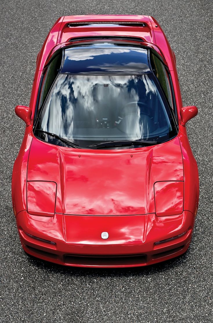 a red sports car parked on the street