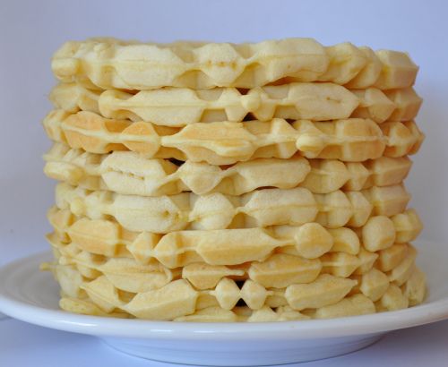 a stack of waffles sitting on top of a white plate