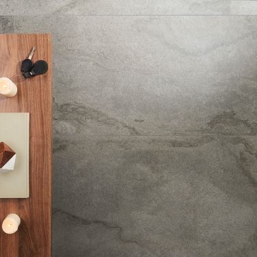 an overhead view of a table with candles and napkins on it, next to a candle holder