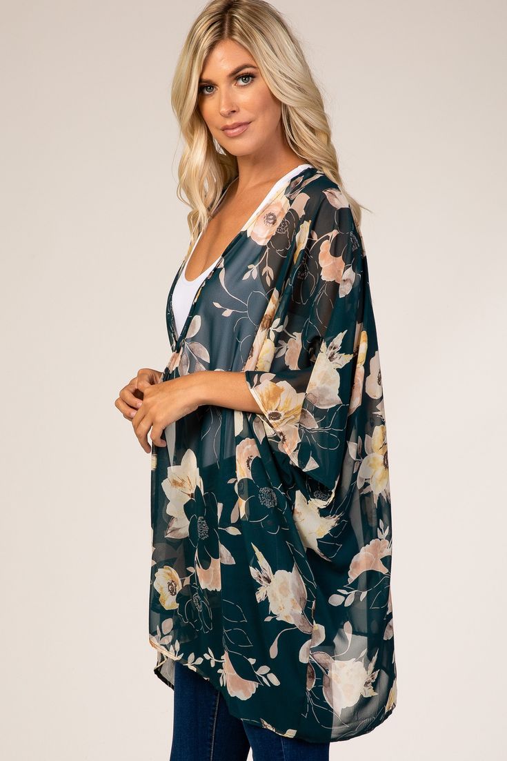 Details A floral cover up featuring an open front and a sheer fabric. Content + Care 100% Polyester Dry Clean or Hand Wash Cold, , No Bleach, Color Separate, , Hang or Line Dry USA Size + Fit Length: 30" Measured From: One Size Product Code: 60649 Summer Floral Print Wrap Cover-up, Floral Print Open Front Cover-up For Vacation, Flowy Open Front Printed Cover-up, Floral Print Wrap Beachwear Cover-up, Spring Sheer Long Sleeve Kimono, Green Open Front Kimono For Beach, Green Open Front Kimono For Beach Cover-up, Green Floral Print Summer Cover-up, Spring Sheer Beach Cover-up