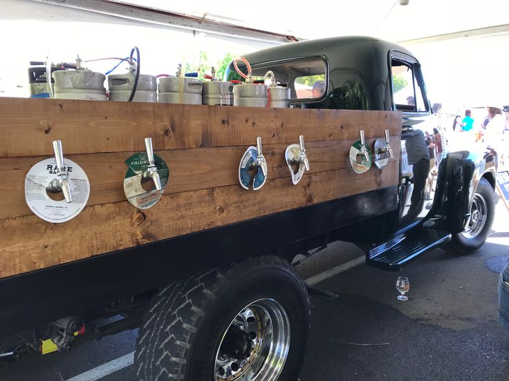 an old pick up truck with many items on the back