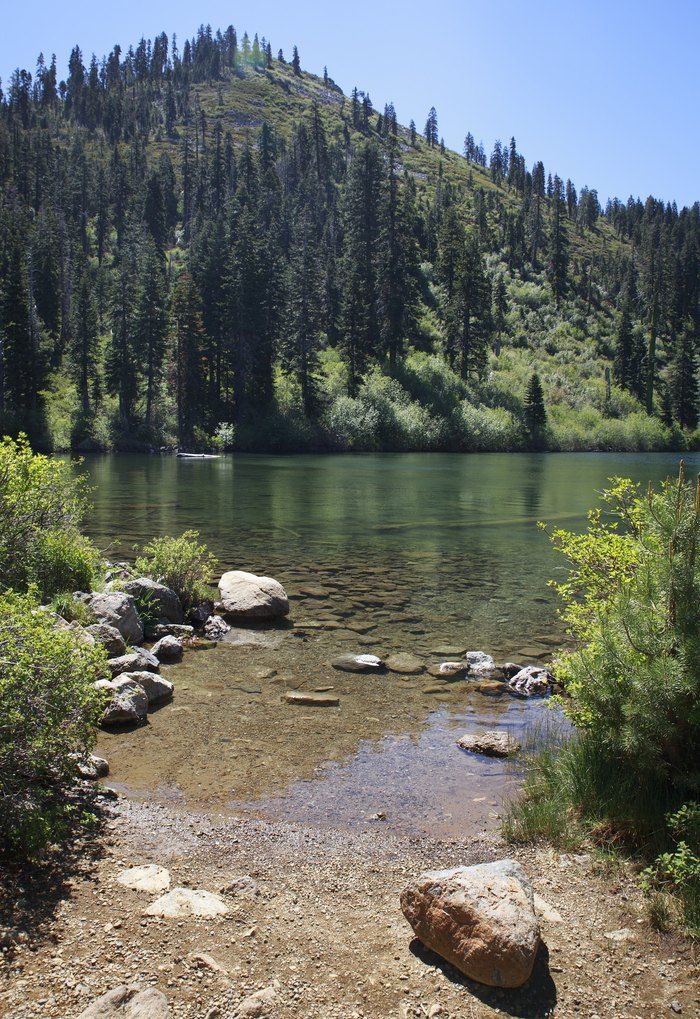 a mountain lake surrounded by trees and rocks