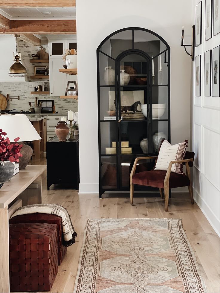 a living room filled with furniture and decor