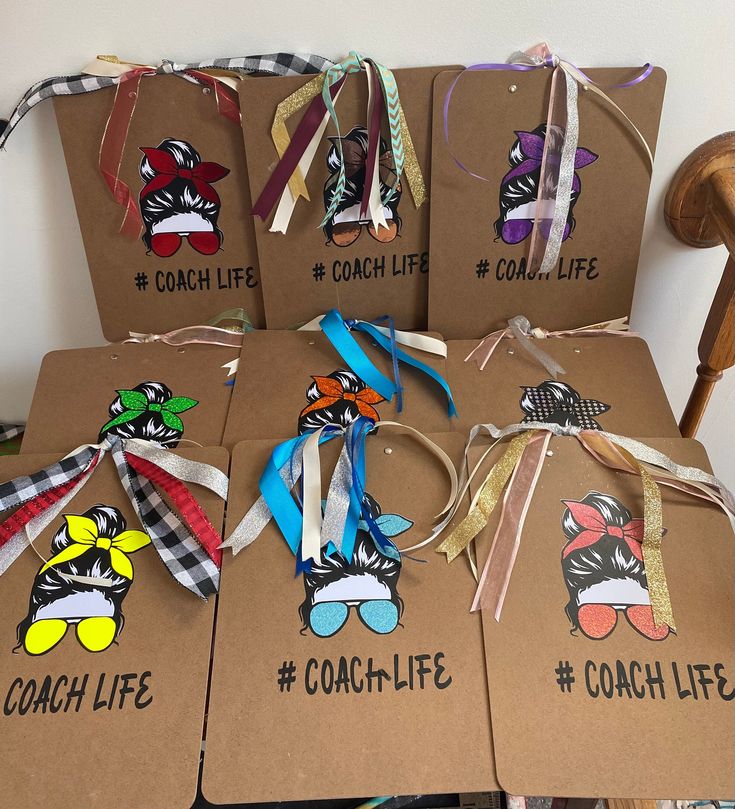 six cardboard tags with different designs on them