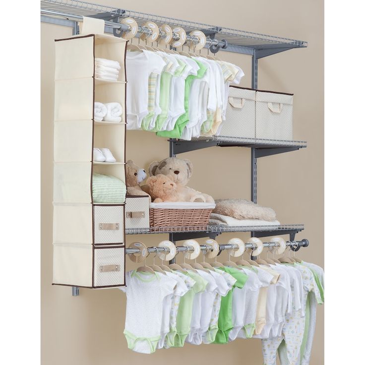 an organized closet with baby clothes and toys