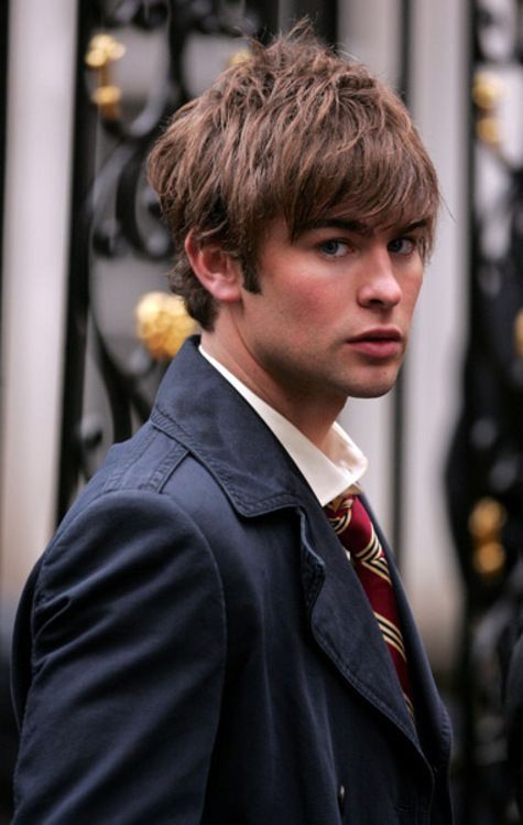 a young man wearing a suit and tie