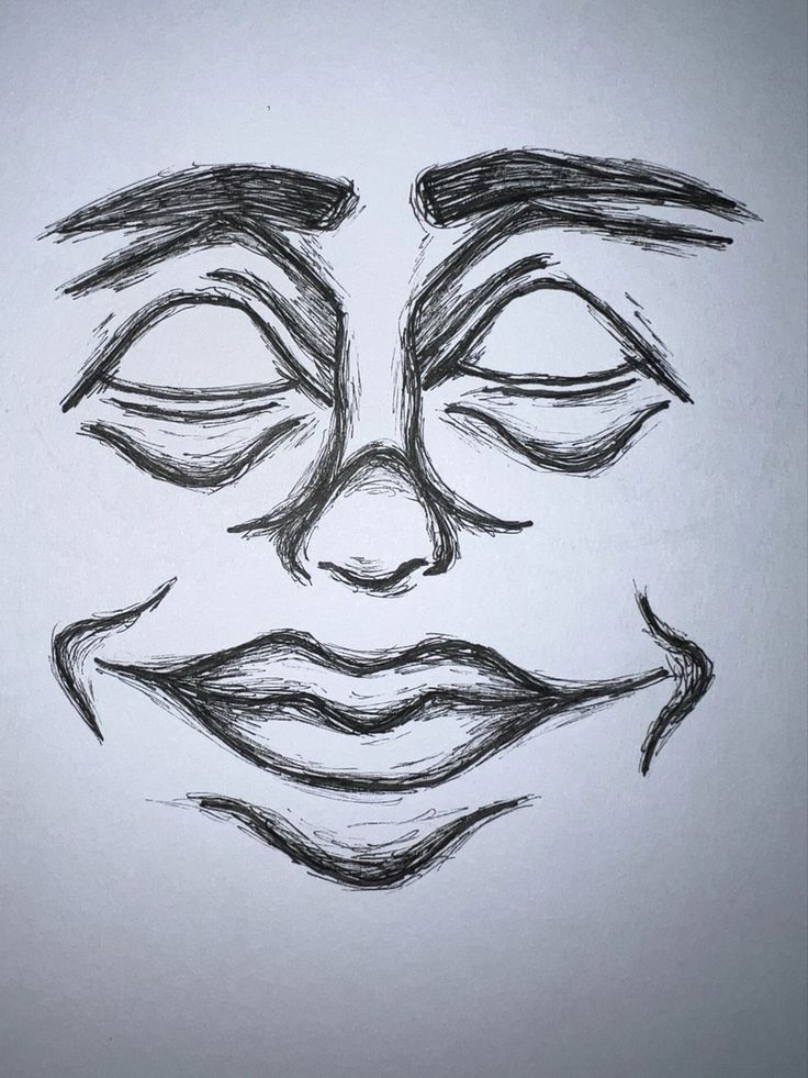 a drawing of a face with eyes drawn in pencil on a sheet of white paper