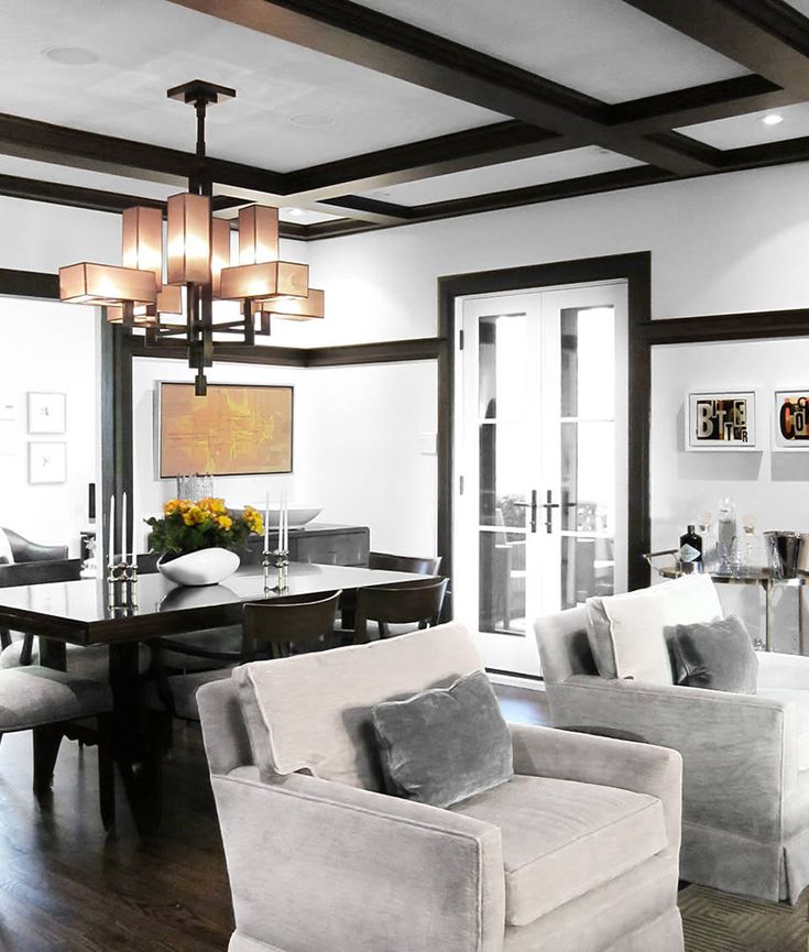 a living room filled with furniture and a chandelier