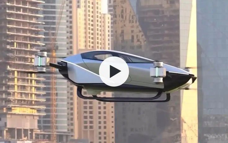 a futuristic car flying through the air over a city