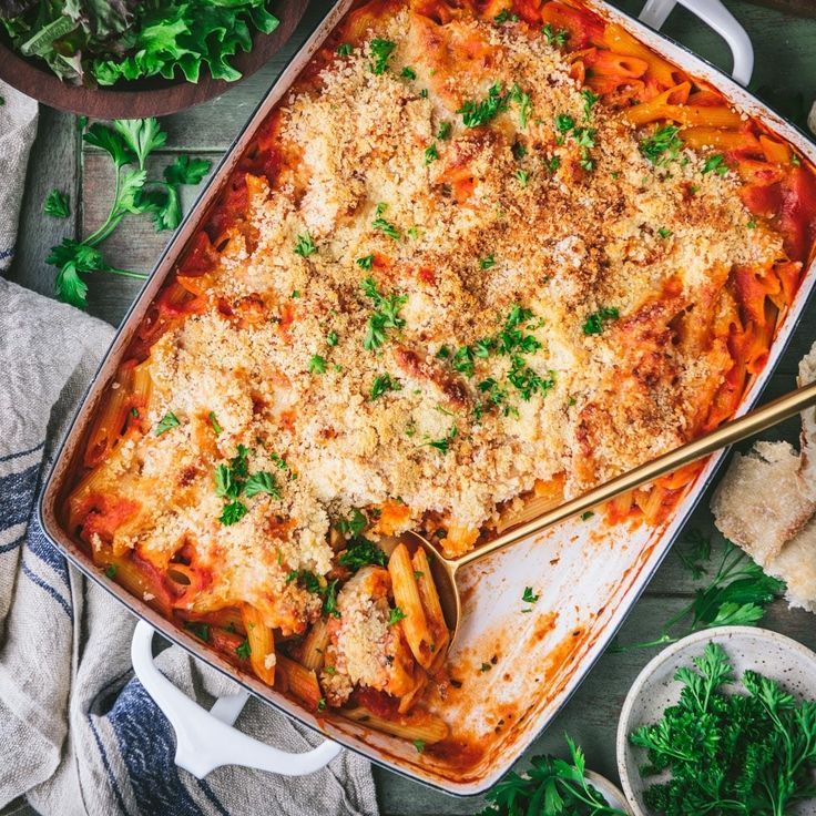 a casserole dish with pasta and parmesan cheese