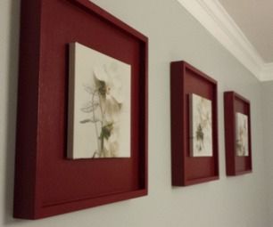 three red framed pictures hang on the wall