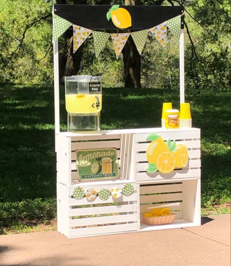 an outdoor lemonade stand with drinks on it