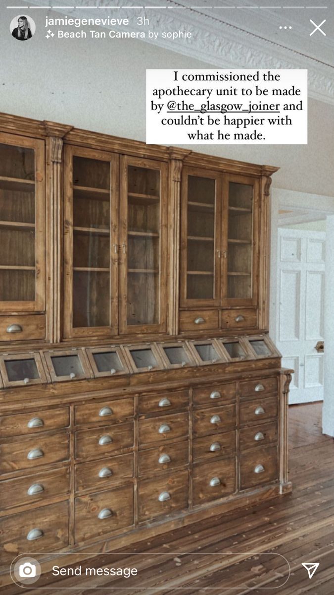 an old wooden cabinet with glass doors and drawers