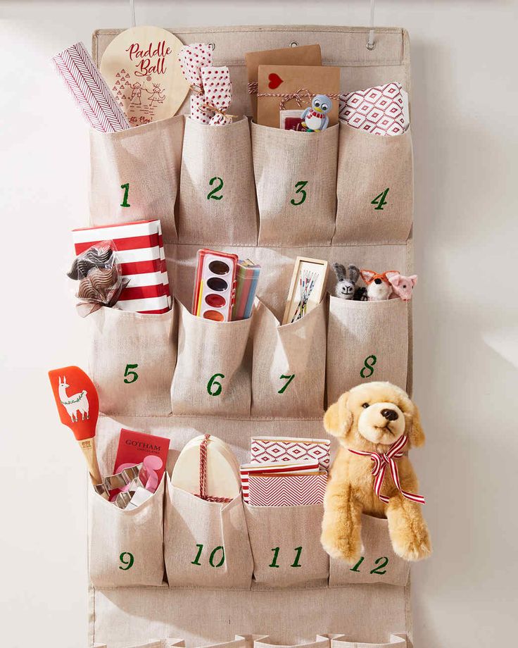 a stuffed animal sitting on top of a shelf next to bags with numbers and other items