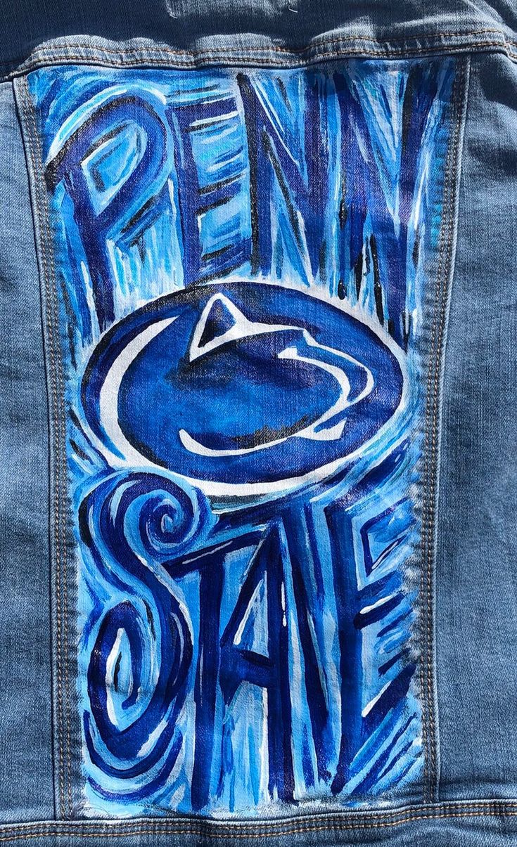 a blue jean jacket with the penn state logo painted on it