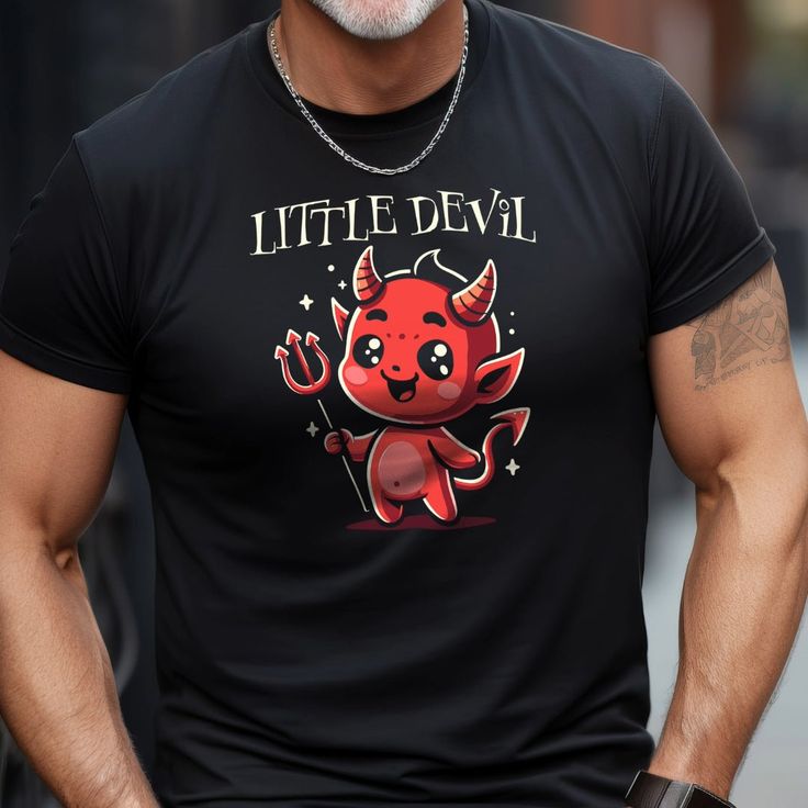 Unleash your playful side with our "Little Devil Tee"! This adorable yet mischievous shirt features a cute, cartoonish devil that's bound to spark smiles and a touch of rebellion. Crafted with comfort in mind, it's perfect for casual outings, themed parties, or simply lounging around with a cheeky attitude. Key Features: Eye-catching cute devil graphic for a playful wardrobe addition Soft, breathable fabric to keep you comfortable all day long Durable print that withstands washing and wear Classic black tee to match any style and occasion Makes a great gift for those who love to walk on the whimsical side of life Novelty Black T-shirt With Character Print, Funny Black T-shirt With Character Print, Black Novelty Shirt With Graphic Print, Black Novelty T-shirt With Character Print, Novelty Black Short Sleeve Shirt, Funny Black Tops With Character Print, Black Punk T-shirt With Cartoon Print, Black Novelty Shirt With Funny Print, Novelty Black Shirt With Funny Print