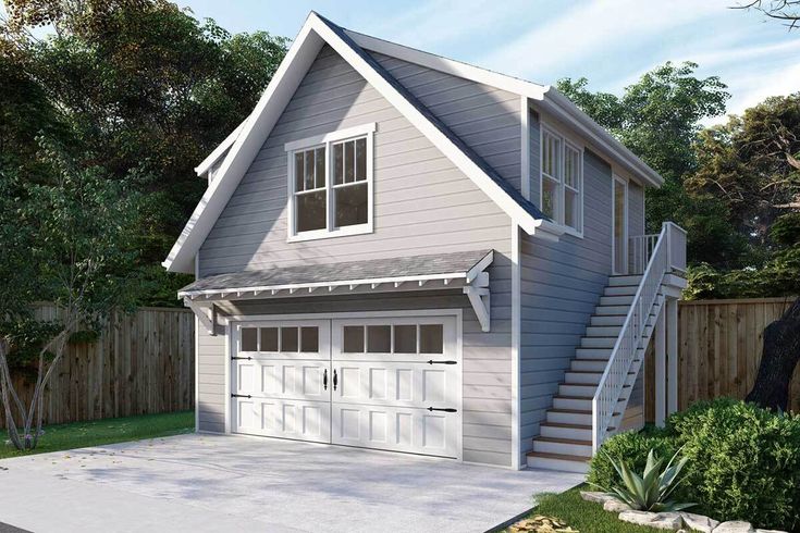 a two car garage with stairs leading up to the second floor and an attached porch